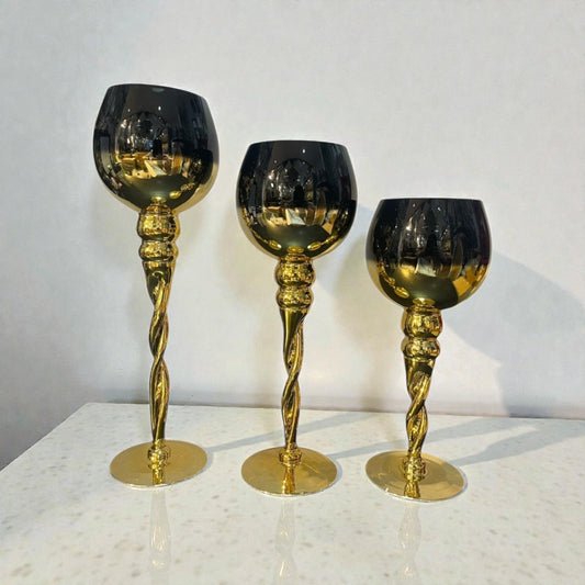Trio de candelabros dorado con negro