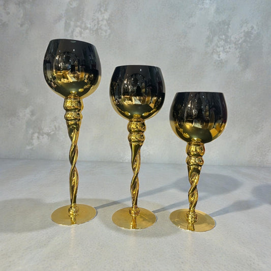 Trio de candelabros dorado con negro